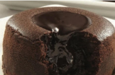 Chocolate lava cake with molten center oozing out.