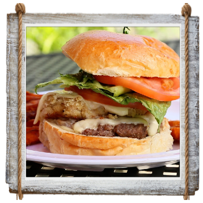 Fresh homemade burger with lettuce and tomato on a bun.