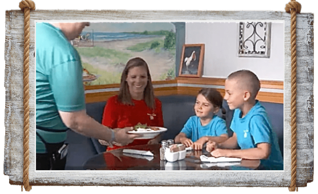 Family enjoying a meal together at the dining table.